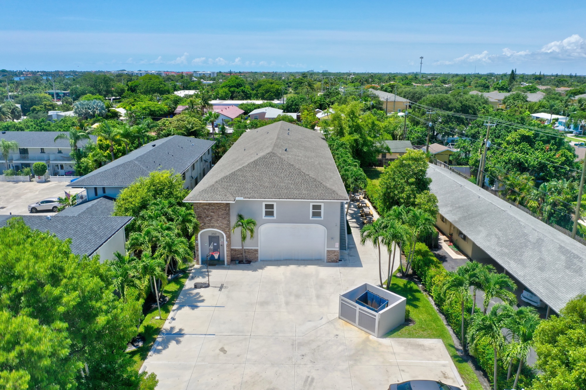 Aerial view of the Ebb Tide residence at 350 W Pine — palms and open sky, West Palm Beach, Florida